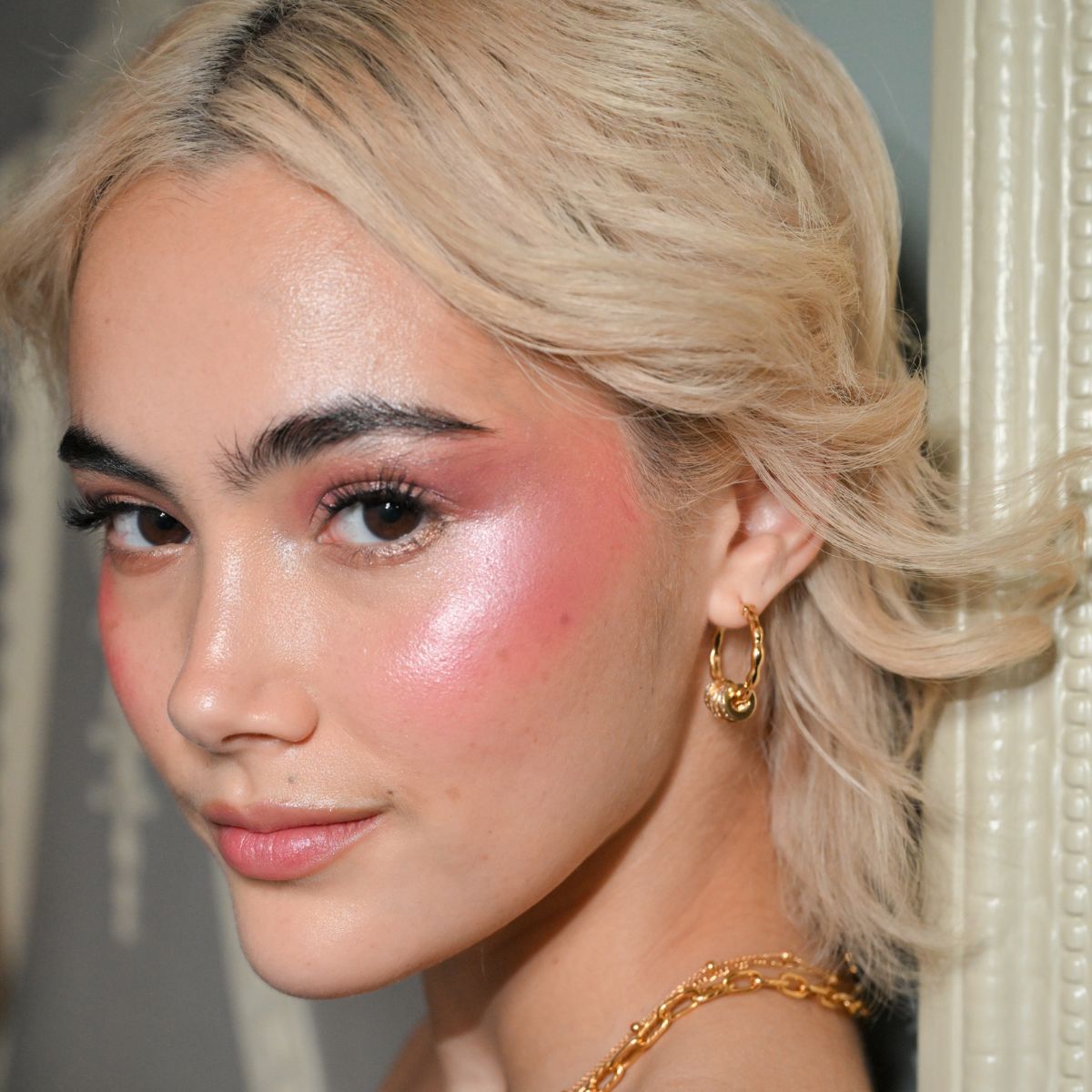a model during fashion week with distinctive blusher looks