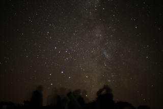 Stargazers on the Isle of Sark, in the Channel Islands off the coast of England, enjoy the wonder of the Milky Way. 