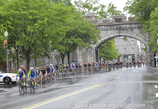 The peloton passes through the gates of the Old City of Quebec.