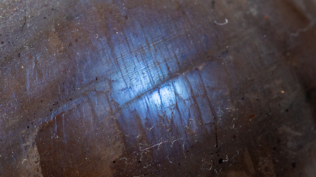 blue flash on a grey moonstone