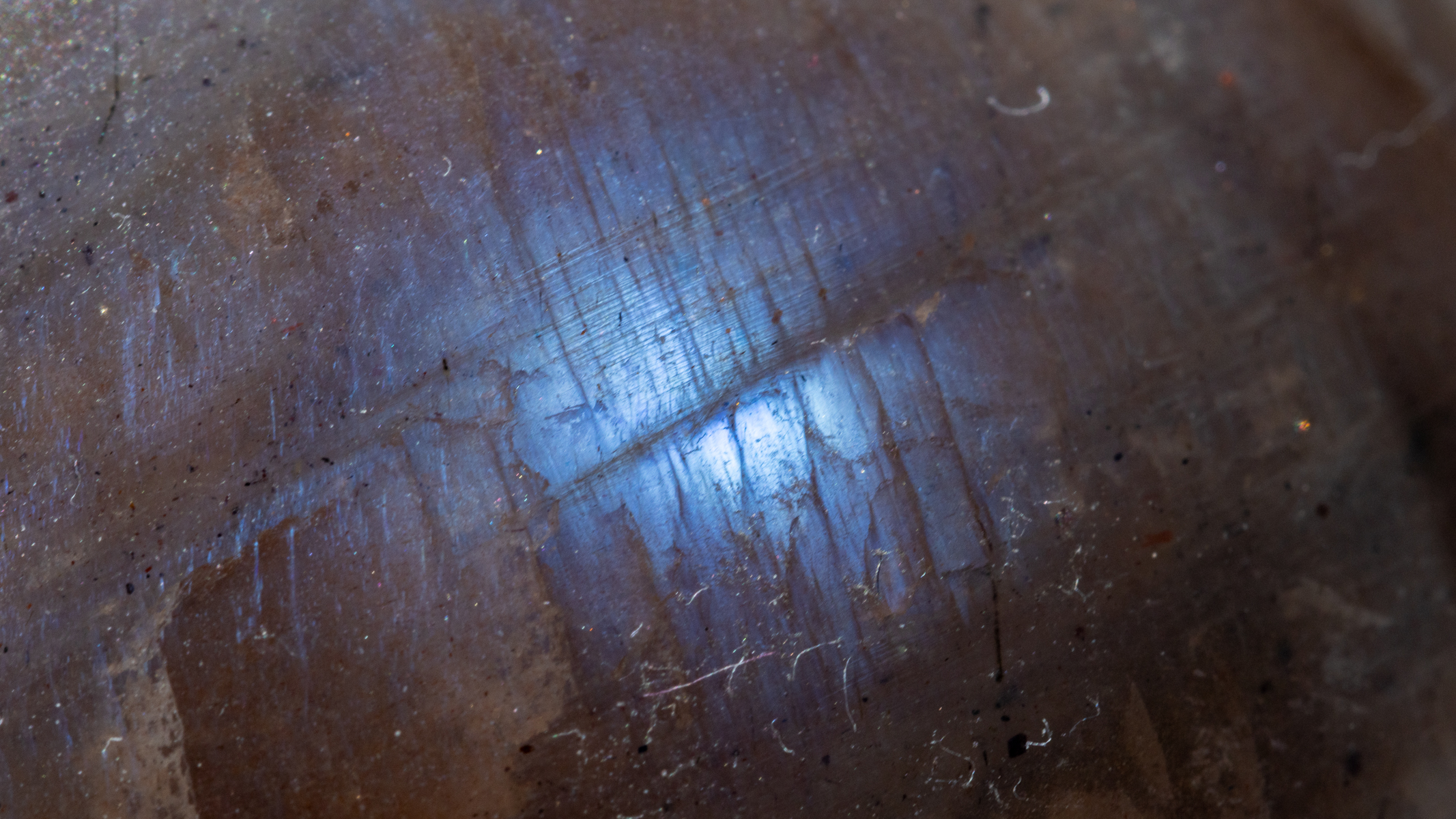 blue flash on a grey moonstone