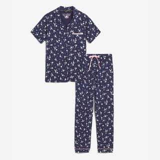flat lay of navy simply be short sleeve pajama set with white star pattern