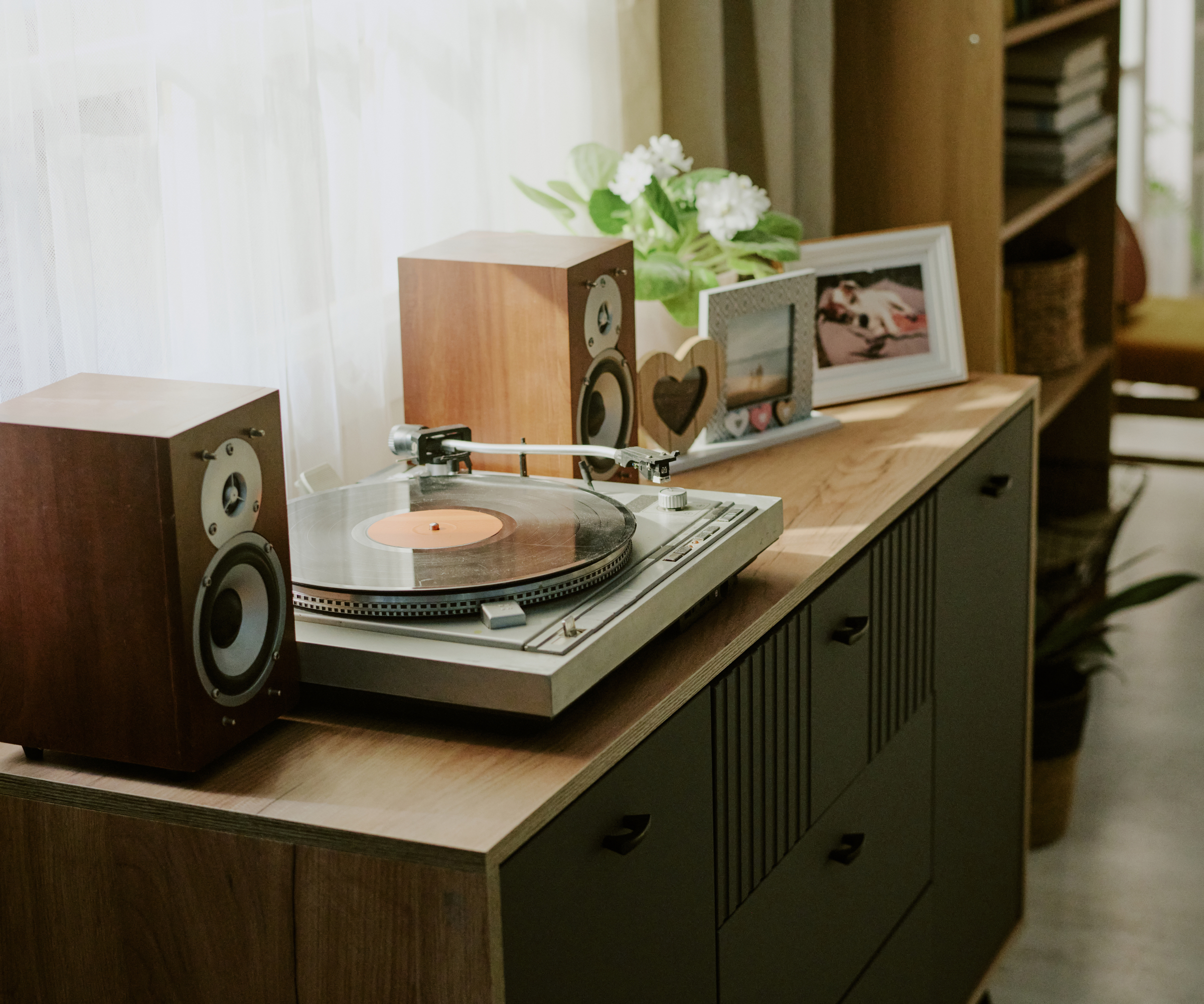 Record player and speakers on sideboard