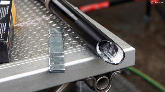 Team mechanics seat weights inside the seatposts as needed to bring bikes up to the minimum 6.8kg weight