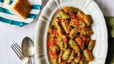 A photo of spinach gnocchi in tomato sauce