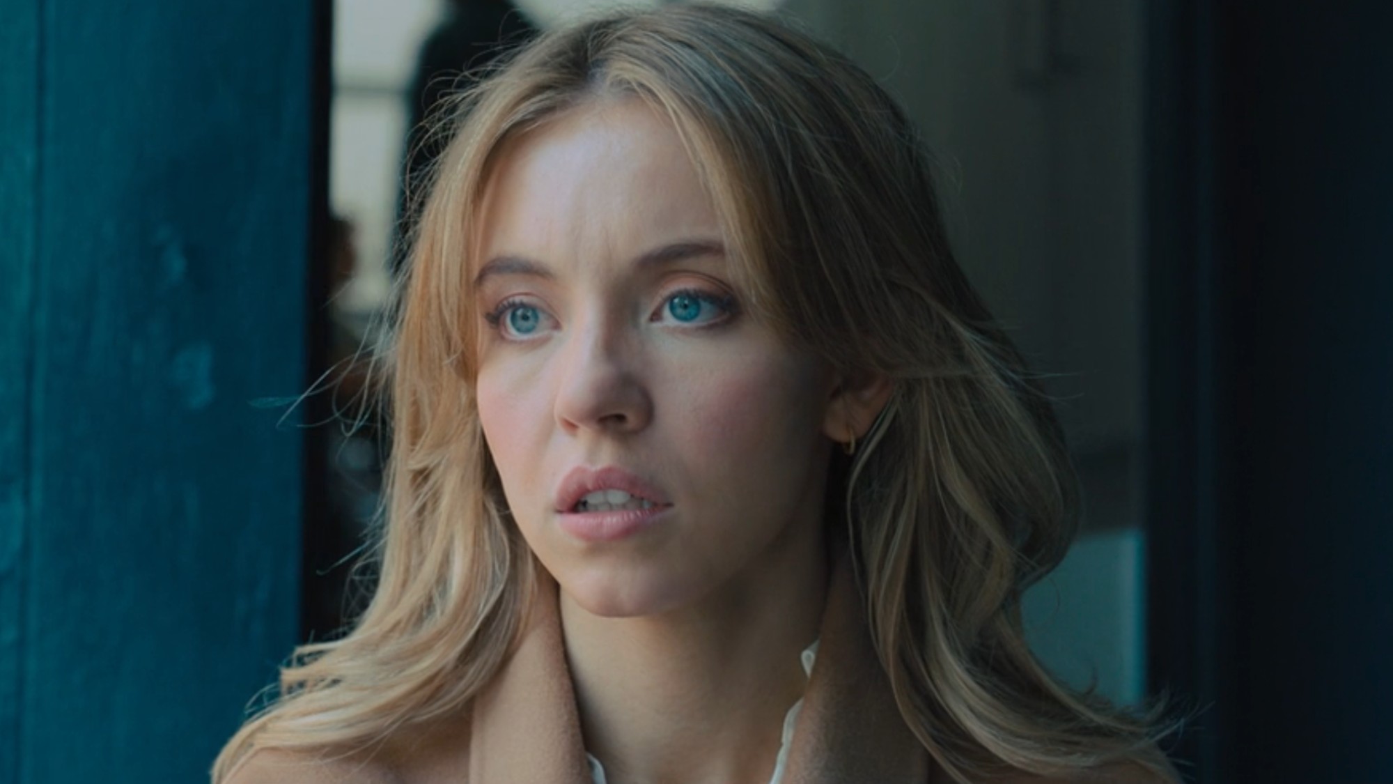 Sydney Sweeney looking concerned in Anyone But You. 