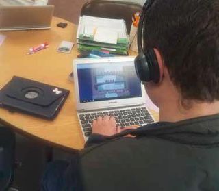 A specialeducation student at Raft River Schools reads an online text.