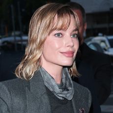 Margot Robbie wore a layered spring look from Armani to an event in Milan 