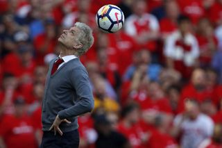 Arsenal's French manager Arsene Wenger heads the ball back into play after it is returned from the crowd during the English Premier League football match between Arsenal and Burnley at the Emirates Stadium in London on May 6, 2018. - Arsene Wenger bids farewell to a stadium he helped to build in more ways than one when he leads Arsenal at the Emirates for the final time at home to Burnley on Sunday. Wenger's final season after 22 years in charge is destined to end in disappointment after Thursday's Europa League semi-final exit.