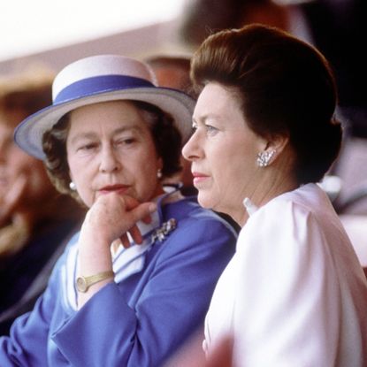 Queen Elizabeth sitting next to Princess Margaret