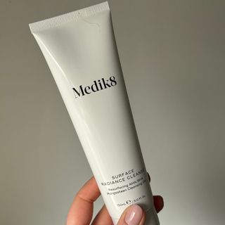 Laura holding Medik8 Surface Radiance Cleanse - best cleanser