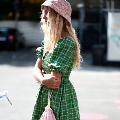 Girl wearing green checked gingham dress