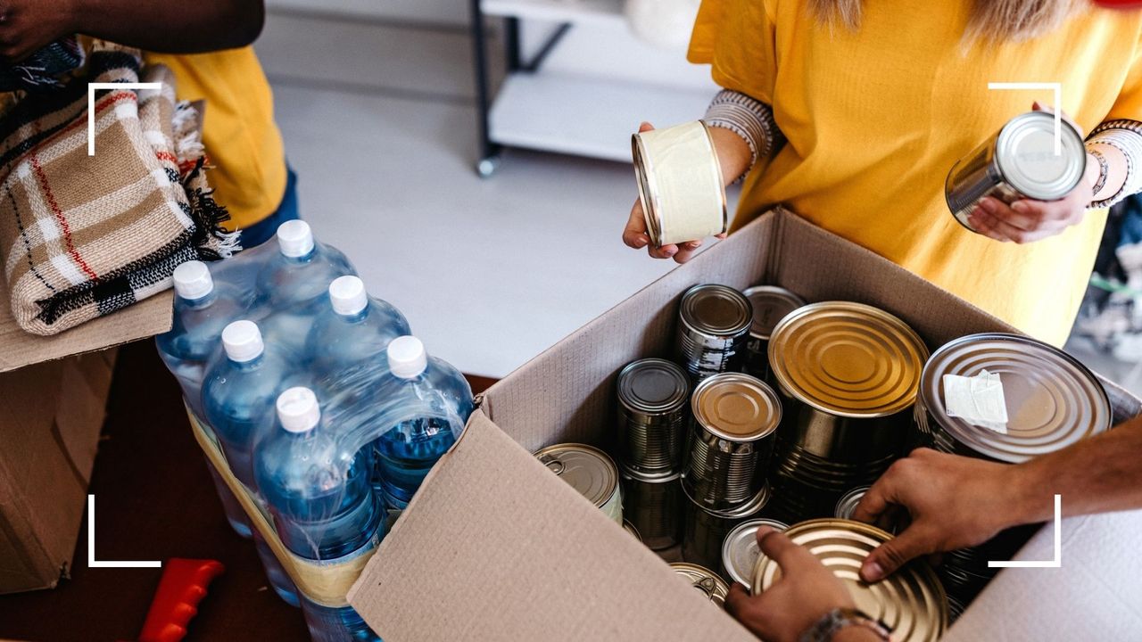 people sorting through donations as they volunteer at Christmas