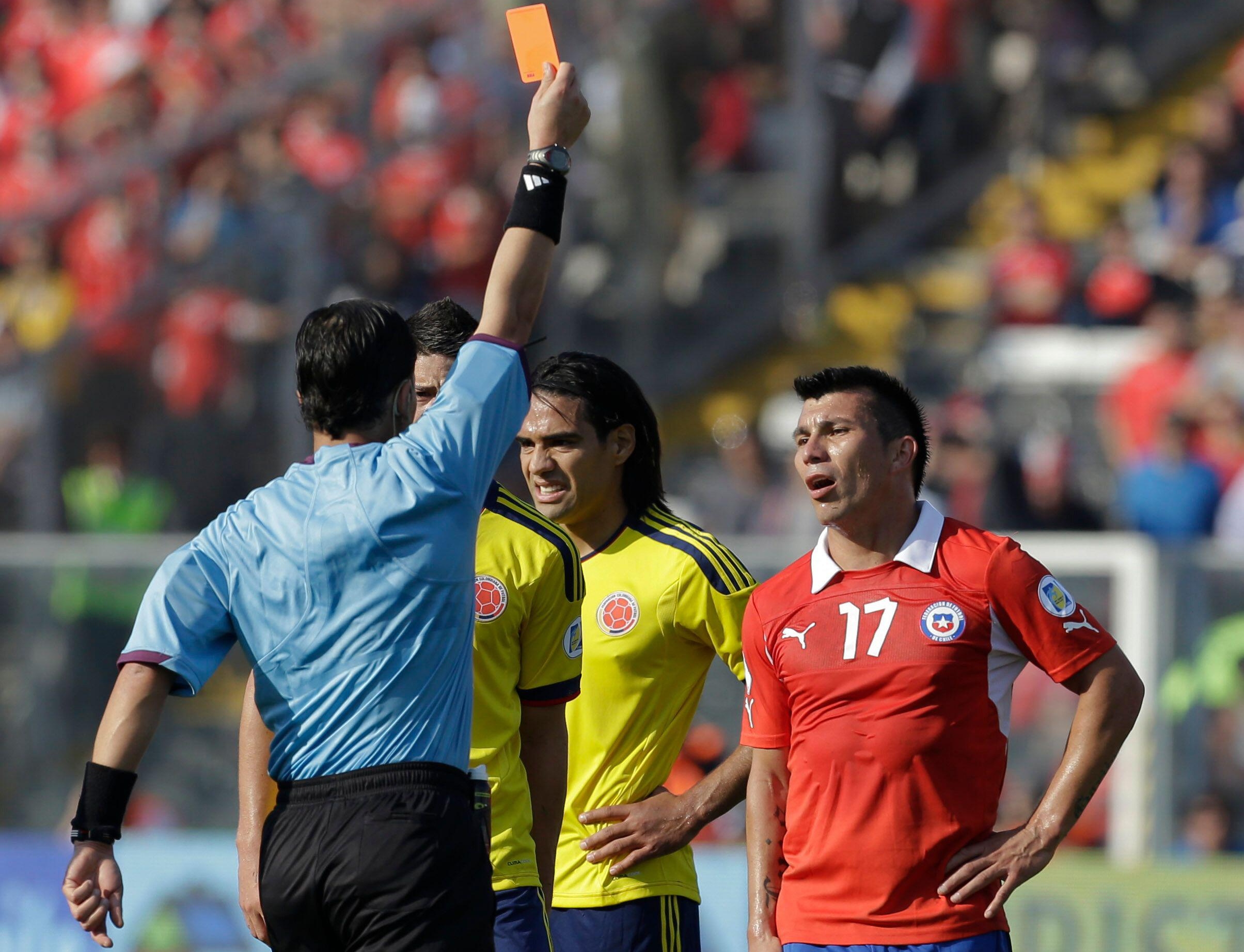 Gary Medel is sent off while playing for Chile against Colombia in a 2014 World Cup qualifier