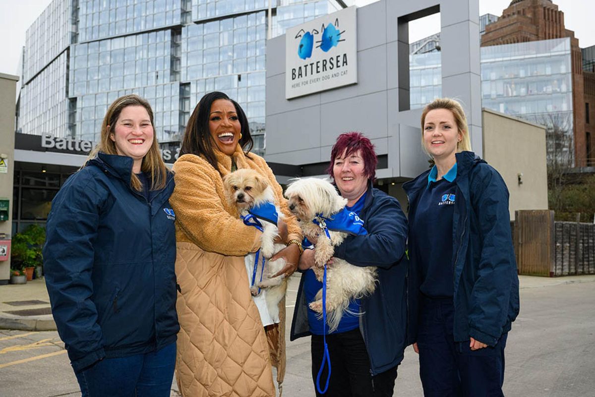 Alison Hammond poses with staff and furry friends from Battersea Cats and Dogs Home