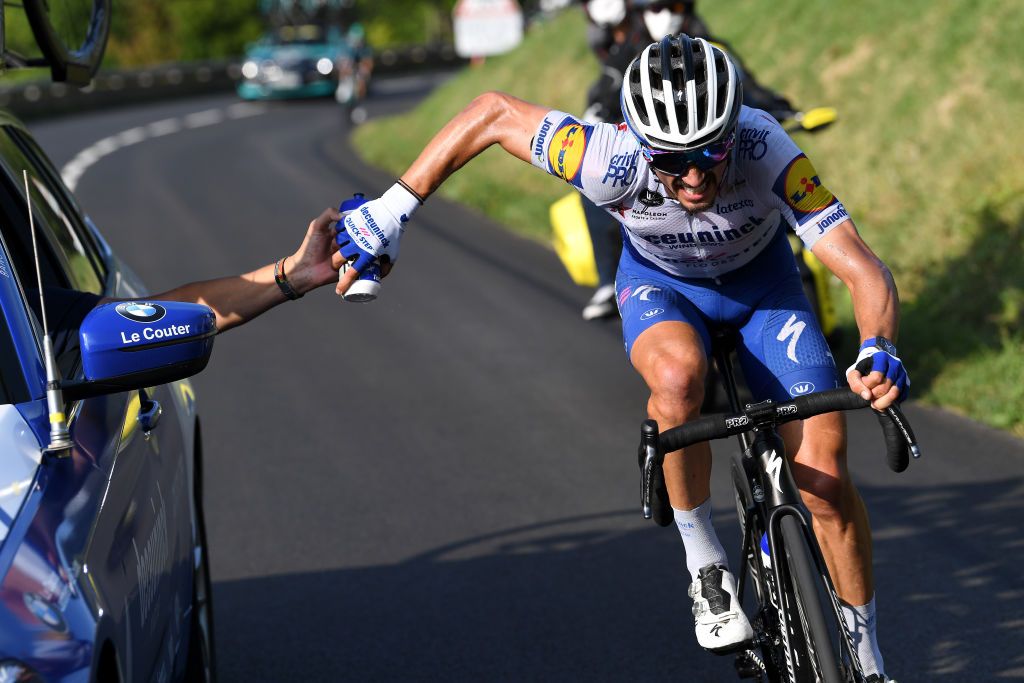 VILLARDDELANS FRANCE SEPTEMBER 15 Julian Alaphilippe of France and Team Deceuninck QuickStep Feeding Tacx bottle Car during the 107th Tour de France 2020 Stage 16 a 164km stage from La TourDuPin to VillardDeLans 1152m Auberge de la Cte 2000 TDF2020 LeTour on September 15 2020 in VillardDeLans France Photo by Tim de WaeleGetty Images