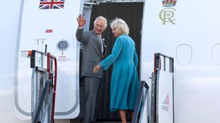 Britain's King Charles III (L) waves goodbye as he boards a plane for the United Kingdom with his wife Queen Camilla (R) at the end of their three day State Visit to France at Bordeaux-Merignac Airport in Bordeaux, southwestern France, on September 22, 2023. Britain's King Charles III and his wife Queen Camilla are on a three-day state visit starting on September 20, 2023, to Paris and Bordeaux, six months after rioting and strikes forced the last-minute postponement of his first state visit as king. (Photo by Chris Jackson / POOL / AFP)