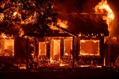 A house burns in Paradise, California.