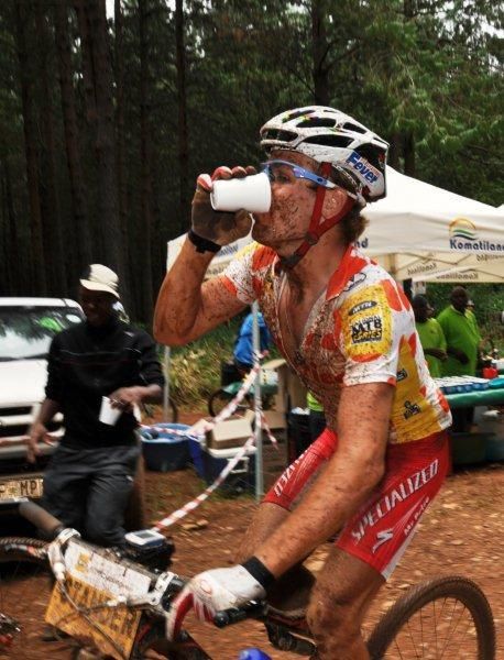 Burry Stander takes on fluid at an aid station.
