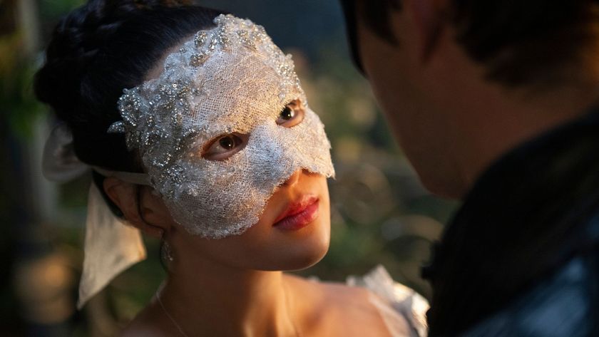 A masked Sophie looks up at Benedict