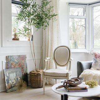 living room with bay window and armchair