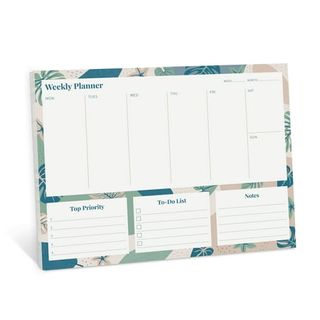 An undated weekly planner with floral decal edges. 