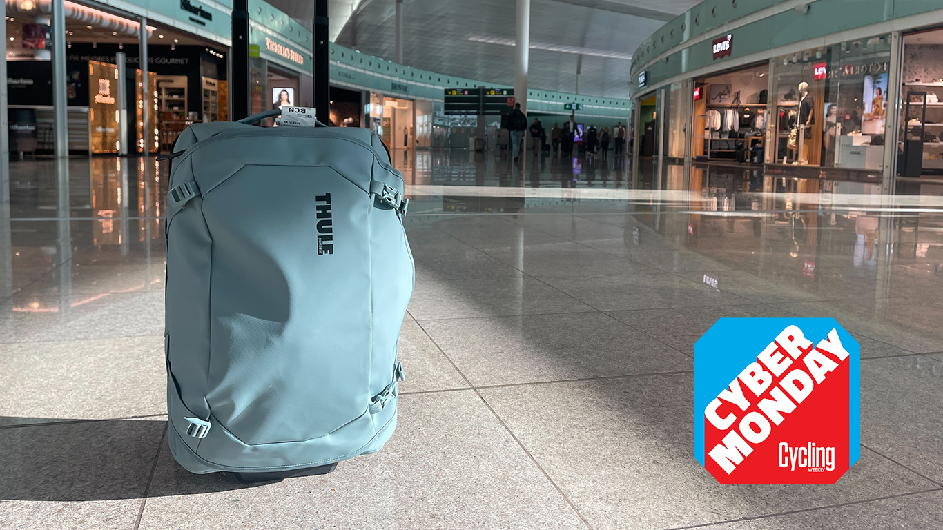 Thule wheeled carry-on in Barcelona airport in front of shops
