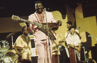 Albert King, holding one of his trademark Flying V guitars, performs with his band at the Montreux Jazz Festival in in Montreux, Switzerland on July 1, 1973