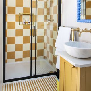 colourful bathroom in zesty yellow with shower