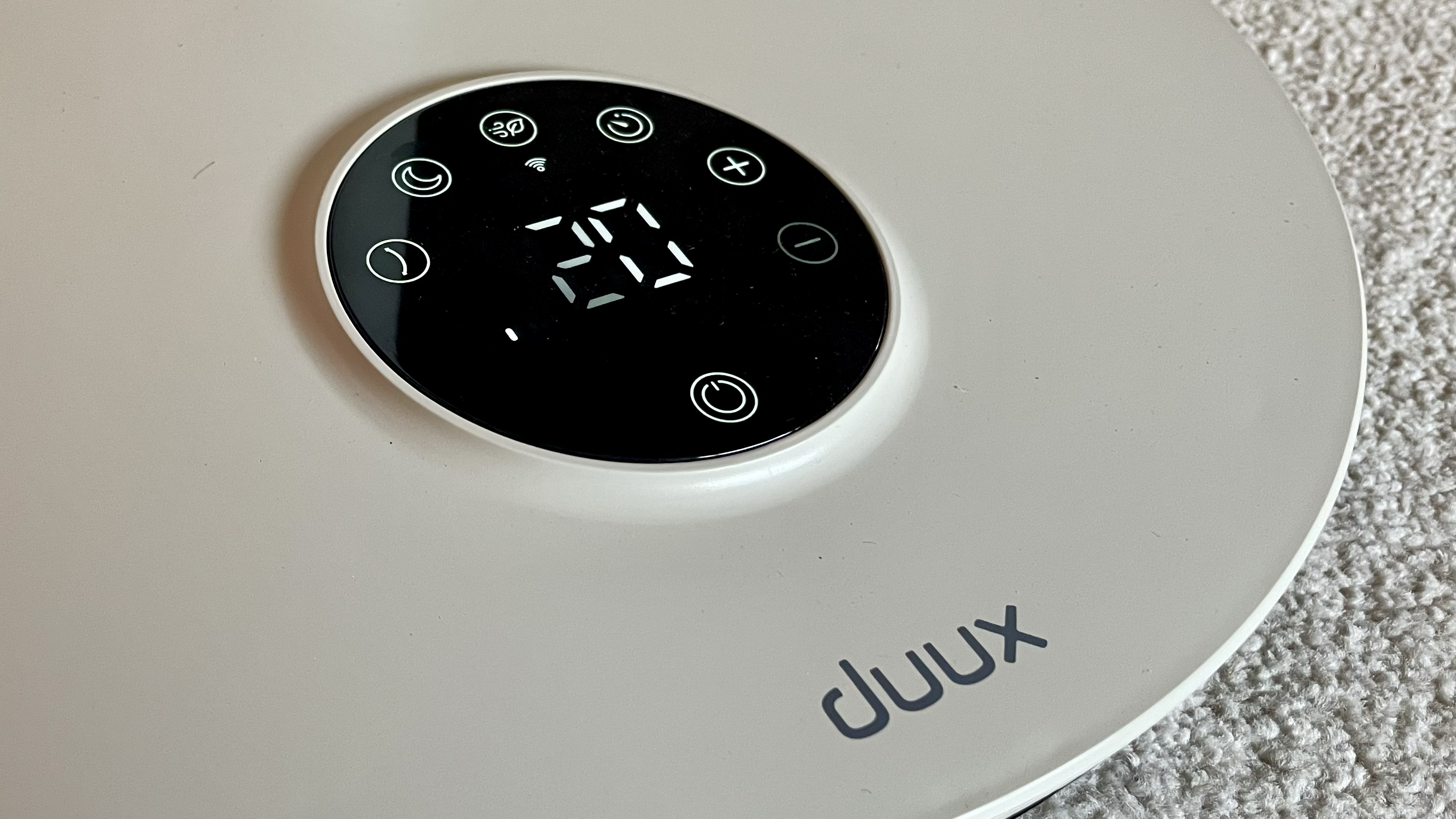 Duux Whisper Flex 2 fan on a pink background
