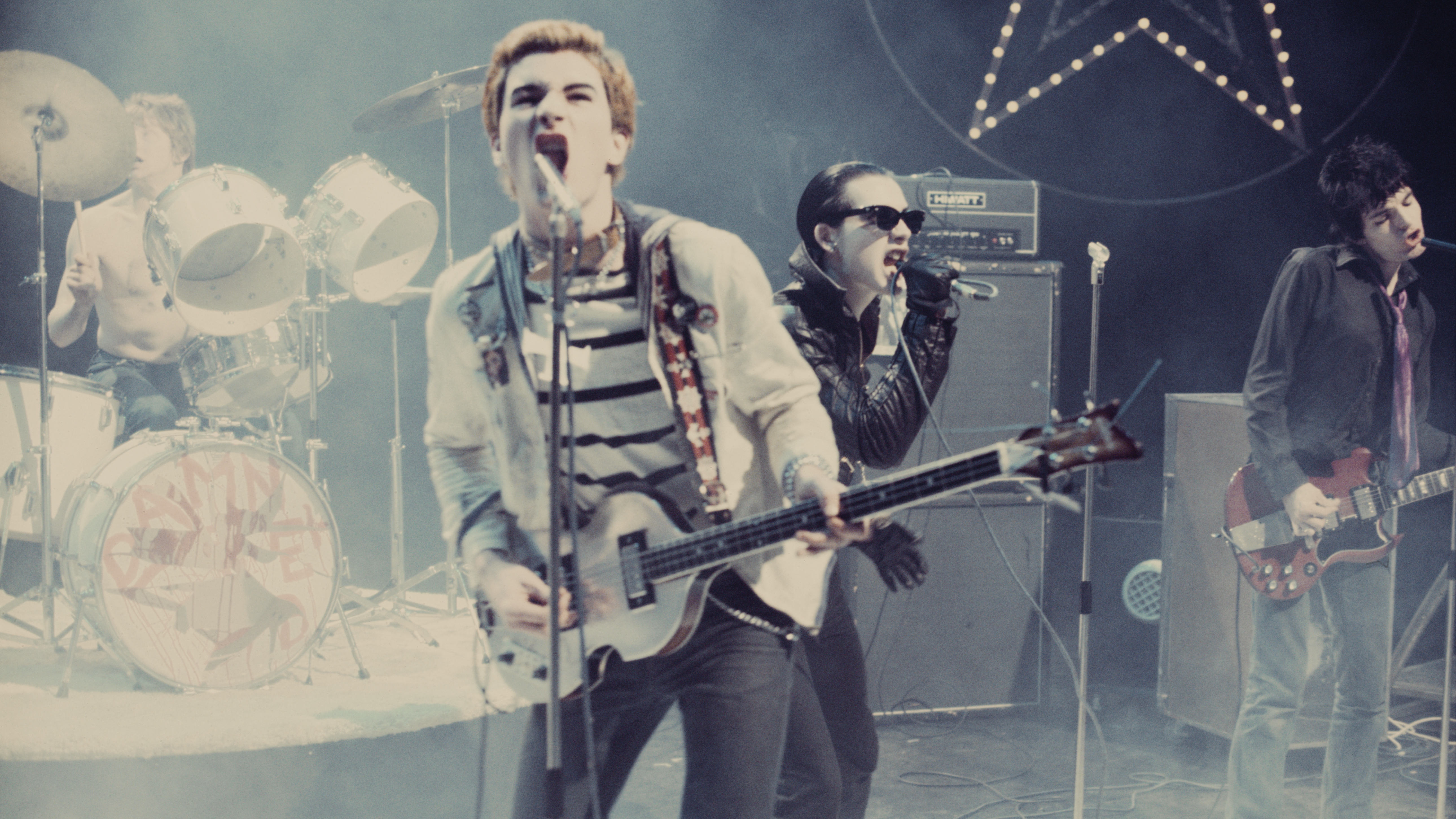 A photograph of The Damned on stage in 1977