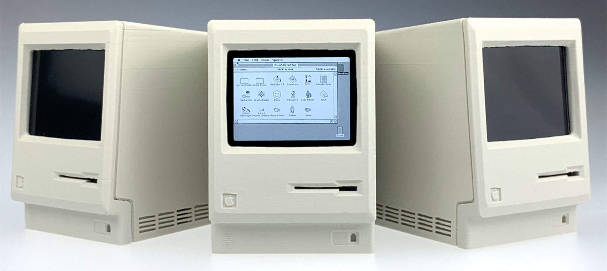 Three Pico-mac-nano mini vintage Macintosh PCs side-by-side on a white background.
