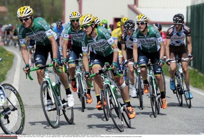 Luis Leon Sanchez flanked by his Caja Rural teamates