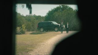 Two men walking from a car in a still from Netflix's docuseries Encounters