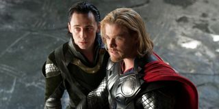 Tom Hiddleston and Chris Hemsworth stand together, in costume, in Thor.