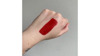 Swatch of Lancome LAbsolu Rouge in French Touch red lipstick