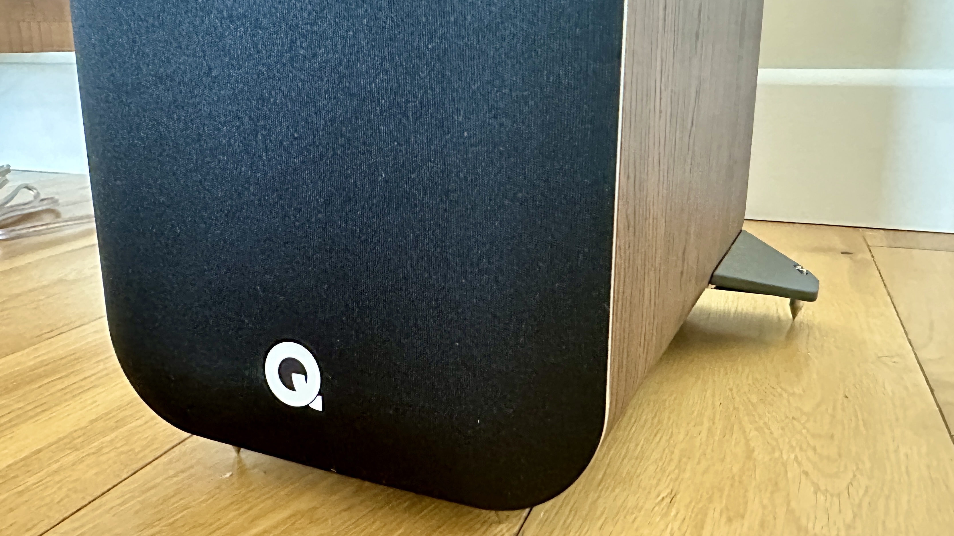 A closeup of the Q Acoustics M40 HD grille and emblem
