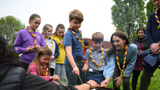 Princess Charlotte of Wales, Prince George of Wales, Prince Louis of Wales and Catherine, Princess of Wales toast marshmallows as they take part in the Big Help Out, during a visit to the 3rd Upton Scouts Hut in Slough on May 8, 2023 in London, England