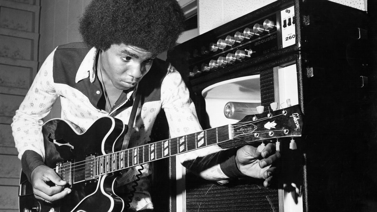 Guitarist Tito Jackson of the R&amp;B quintet &quot;Jackson 5&quot; tunes his Gibson hollow body electric guitar in circa 1975.