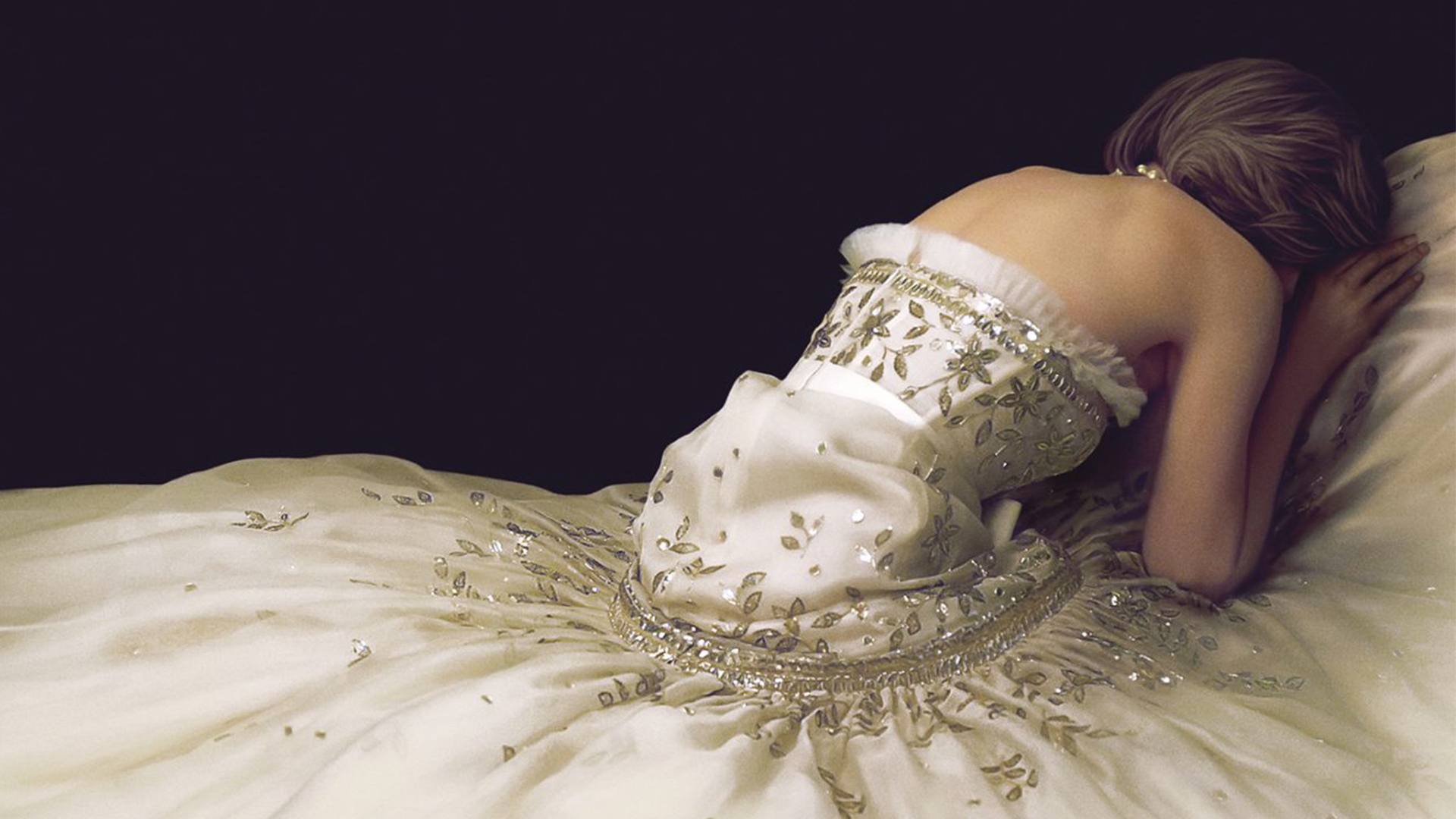 An image of a woman in a wedding dress facing away from the camera, seemingly upset.