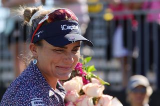 An emotional Lexi Thompson holds a bouquet of flowers after the 2024 CME Group Tour Championship