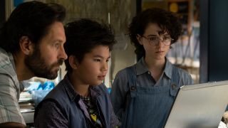 Paul Rudd, Logan Kim, and McKenna Grace researching together on the computer in Ghostbusters: Afterlife.