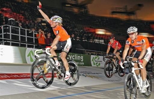 Switzerland's Bruno Risi (L) and Franco Marvulli (R) of the SalzburgerLand team greet the crowd in the opening of the Munich Six Days.