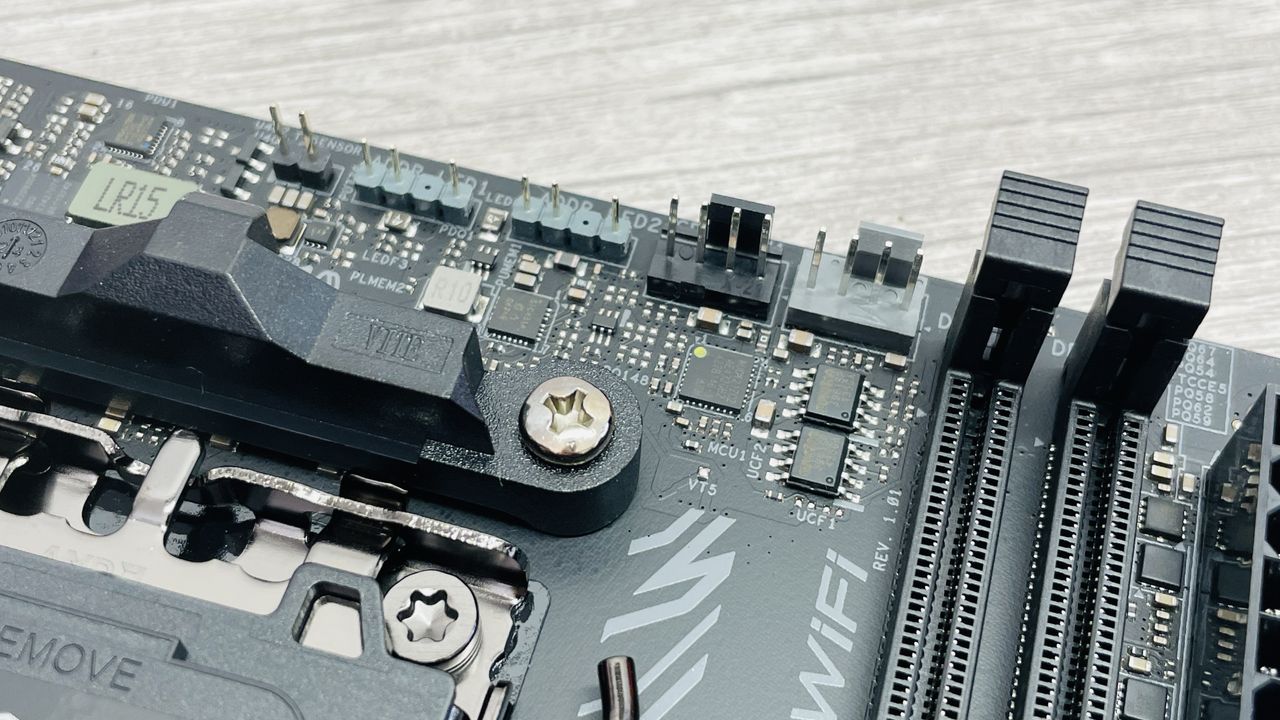 ASRock Phantom Gaming B850I Lightning Wi-Fi motherboard on a desk.