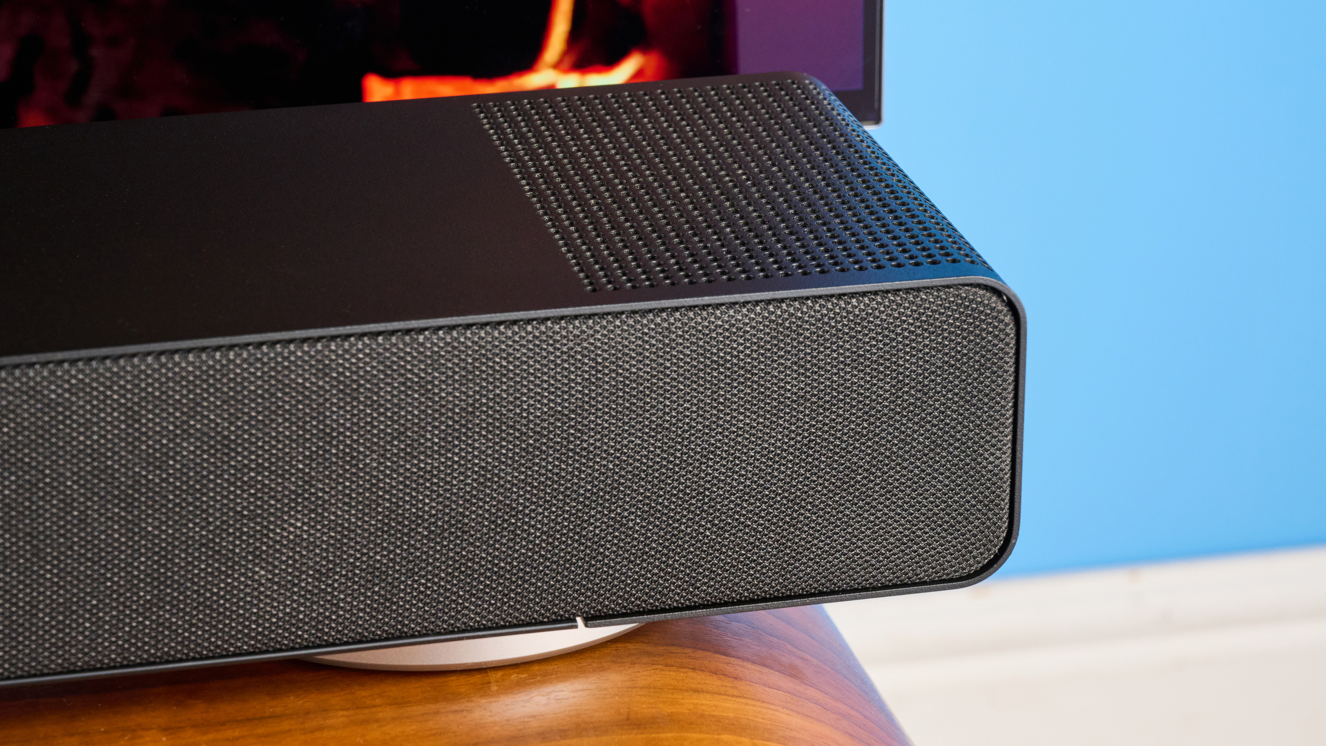 the yamaha true x surround 90a soundbar with dolby atmos, subwoofer, surround rear wireless speakers, and a 5.1.4 channel configuration photographed alongside a TV