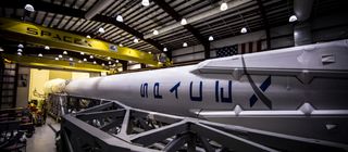 A SpaceX Falcon 9 rocket equipped with landing legs is seen in this image from the private spaceflight company's website. SpaceX will attempt to land the first stage of its Falcon 9 rocket on an ocean platform on Feb. 8, 2015 after launching the Deep Spac