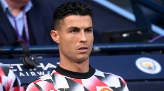 Manchester United striker Cristiano Ronaldo looks on from the bench during the Premier League match between Manchester City and Manchester United on 2 October, 2022 at the Etihad Stadium, Manchester, United Kingdom