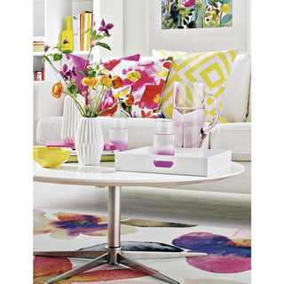 living room with round table with flower vase