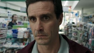 Eddie standing at pharmacy counter in IT: Chapter 2