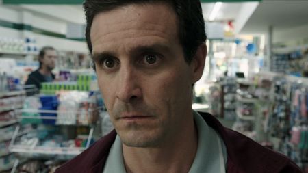 Eddie standing at pharmacy counter in IT: Chapter 2